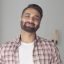 istockphoto-1343910742-640×640 Headshot portrait of attractive confident indian Hispanic man looking at camera standing at modern living room. Latin businessman posing in casual stylish look at home office.